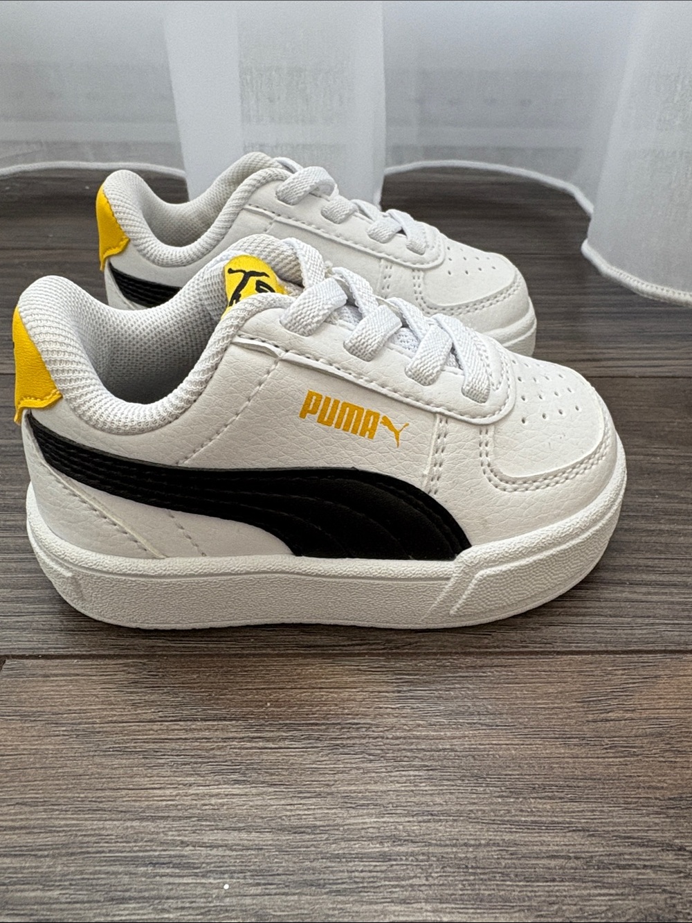 Puma White Toddler Sneakers with Black Stripe and Yellow Details